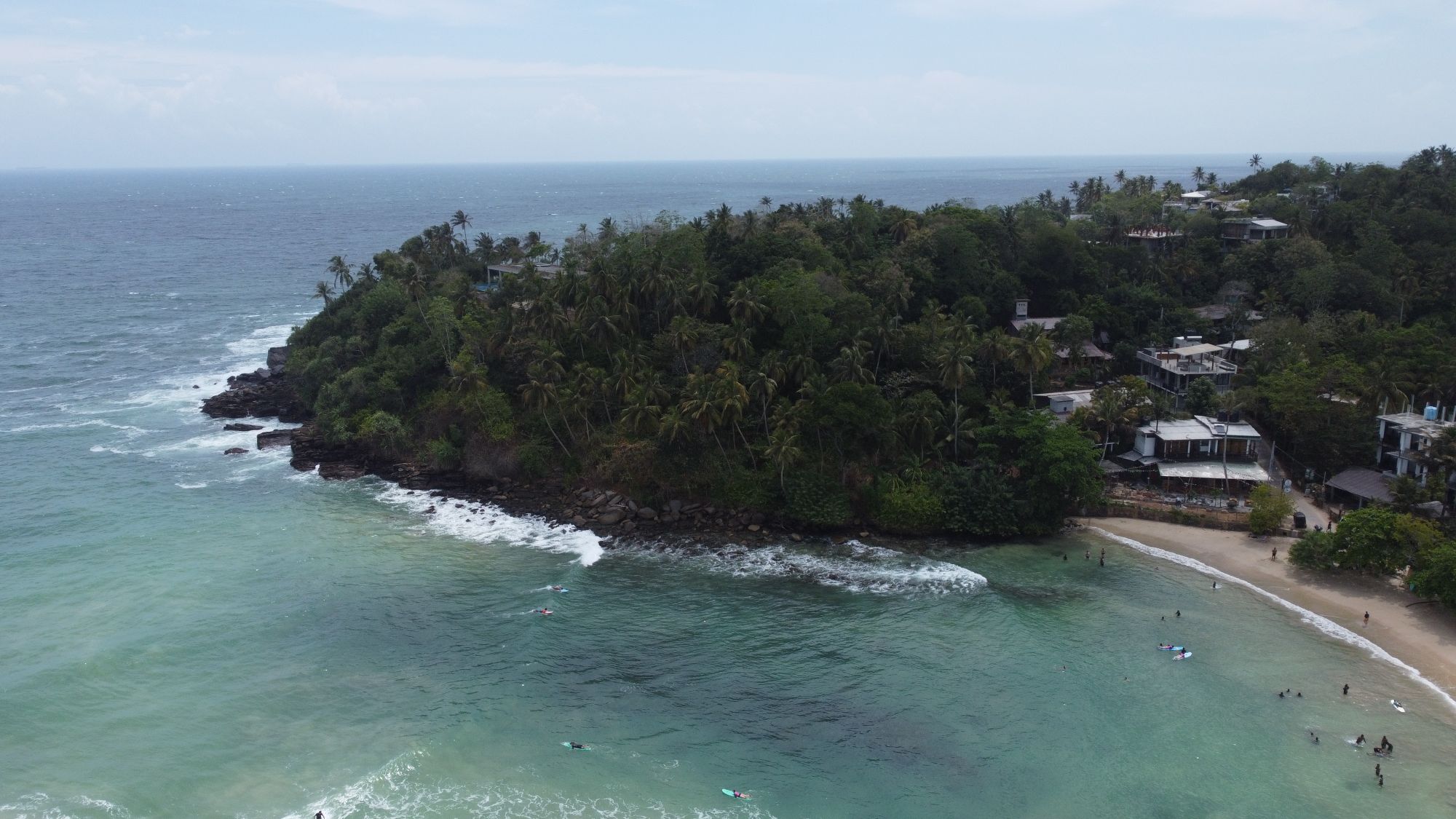 Palm-covered headland and the sea at Hiriketiya, Sri Lanka